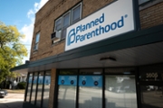 KENOSHA, WISCONSIN - SEPTEMBER 25: A sign marks the location of a Planned Parenthood clinic on September 25, 2025 in Kenosha, Wisconsin. Planned Parenthood of Wisconsin will reportedly pause scheduling abortion appointments starting Oct. 1, due to fears of losing Medicaid funding because of a provision in the Trump administration's federal funding bill which bars clinics that provide abortions from accepting Medicaid funds for any of their other reproductive services.  (Photo by Scott Olson/Getty Images)