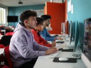Students sitting at their desk in classroom at university