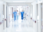 Doctors walking down hospital corridor.