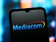 CANADA - 2025/07/26: In this photo illustration, the Mediacom Communications Corporation logo is seen displayed on a smartphone screen. (Photo Illustration by Thomas Fuller/SOPA Images/LightRocket via Getty Images)