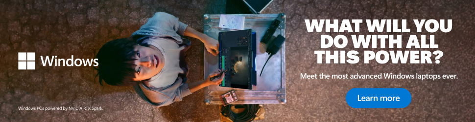 A man working at a desk and looking up
