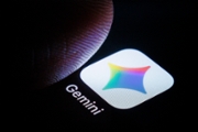 BERLIN, GERMANY - MARCH 06: In this photo illustration the logo of Google Gemini can be seen next to a finger on a smartphone on March 06, 2026 in Berlin, Germany. (Photo by Thomas Trutschel/Photothek via Getty Images)