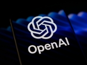 The OpenAI logo is displayed on a smartphone screen placed on a reflective surface onto which an illustration of blue flows is projected, as OpenAI releases GPT-5.4-Cyber, a model optimized for cybersecurity, in Creteil, France, on April 16, 2026. (Photo by Samuel Boivin/NurPhoto via Getty Images)