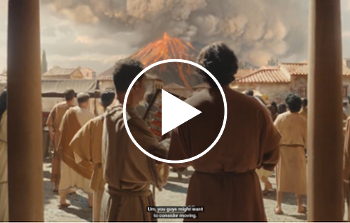 Two males in an ancient setting, standing between two pillars looking towards an erupting volcano.