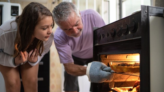 Why do microwaves cook food so much faster than ovens do?