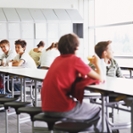 Schoolchildren (12-16) having break in canteen