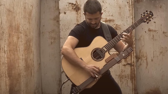 This insane acoustic fingerstyle cover of Dire Straits' Money For Nothing is the most incredible guitar playing you'll see today