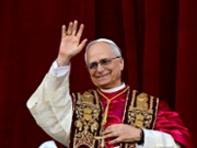 Newly elected Pope Leo XIV, Robert Prevost addresses the crowd from the main central loggia balcony of the St Peter's Basilica for the first time, after the cardinals ended the conclave, in The Vatican, on May 8, 2025. Robert Francis Prevost was on Thursday elected the first pope from the United States, the Vatican announced. A moderate who was close to Pope Francis and spent years as a missionary in Peru, he becomes the Catholic Church's 267th pontiff, taking the papal name Leo XIV. (Photo by Tiziana FABI / AFP) (Photo by TIZIANA FABI/AFP via Getty Images)          