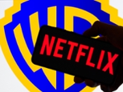 The Netflix logo is displayed on a mobile phone with the Warner Bros. Discovery icon seen in the background, in this photo illustration in Brussels, Belgium, on December 9, 2025. (Photo by Jonathan Raa/NurPhoto via Getty Images)