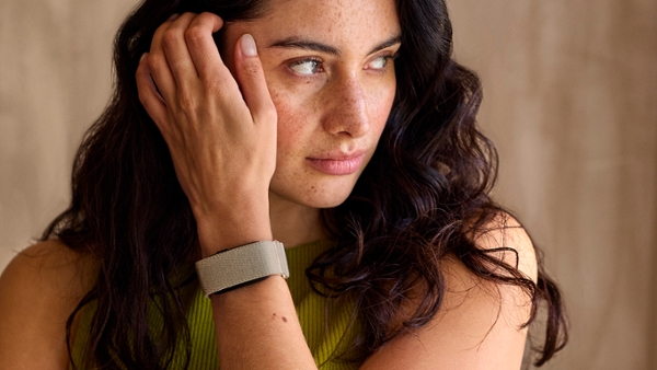 A woman wearing a Garmin Cirqa