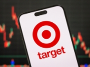 CHONGQING, CHINA - MARCH 3: In this photo illustration, the Target Corporation logo is displayed on a smartphone screen, with the company's latest stock market performance and candlestick charts visible in the background, highlighting Target's real-time financial trends, stock price fluctuations, market volatility, and investment developments within the retail, e-commerce, and consumer goods sectors, on March 3, 2025, in Chongqing, China. (Photo by Cheng Xin/Getty Images)