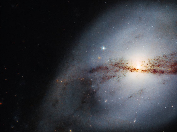 Hubble telescope images twisted galaxy shaped by a big neighbor