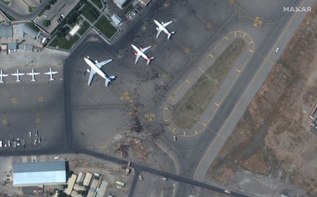 Crowds surge on Afghanistan airport in satellite photos