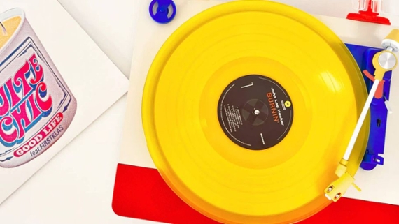 top down shot of a record player with a yellow deck
