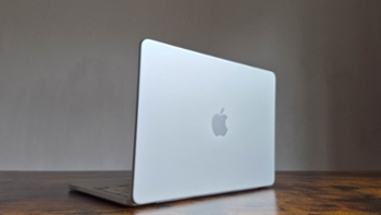 The MacBook Neo in silver on a desk.
