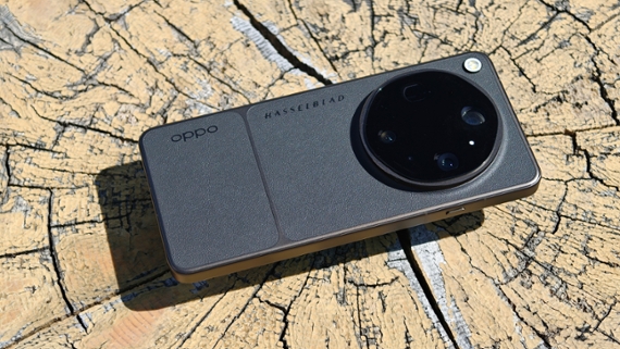 Oppo Find X9 Ultra smartphone place on a cut tree trunk