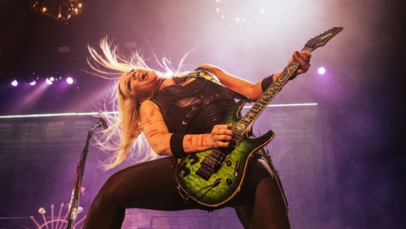 Nita Strauss electrocutes internet trolls with shred guitar lightning in the Eruption-inspired solo from her new track, Digital Bullets