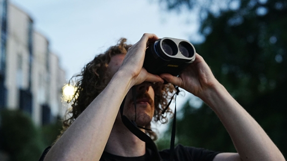 a person looking through binoculars