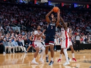Tarris Reed Jr. of the Connecticut Huskies grabs a rebound against St. John's Red Storm defenders during the BIG EAST Men's Basketball Tournament at Madison Square Garden in New York City, New York, on March 14, 2026. (Photo by Federico Torres/NurPhoto via Getty Images)