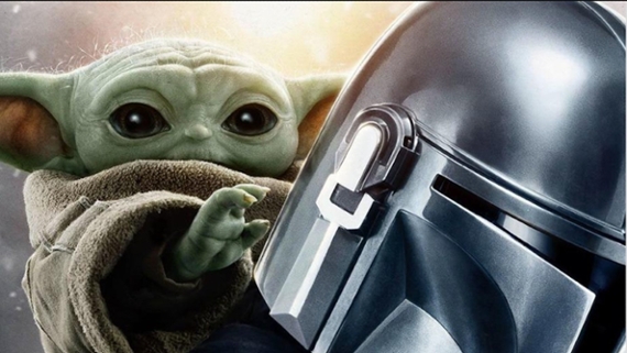 a small humanoid alien with green skin clings to the back of a person wearing silver armor