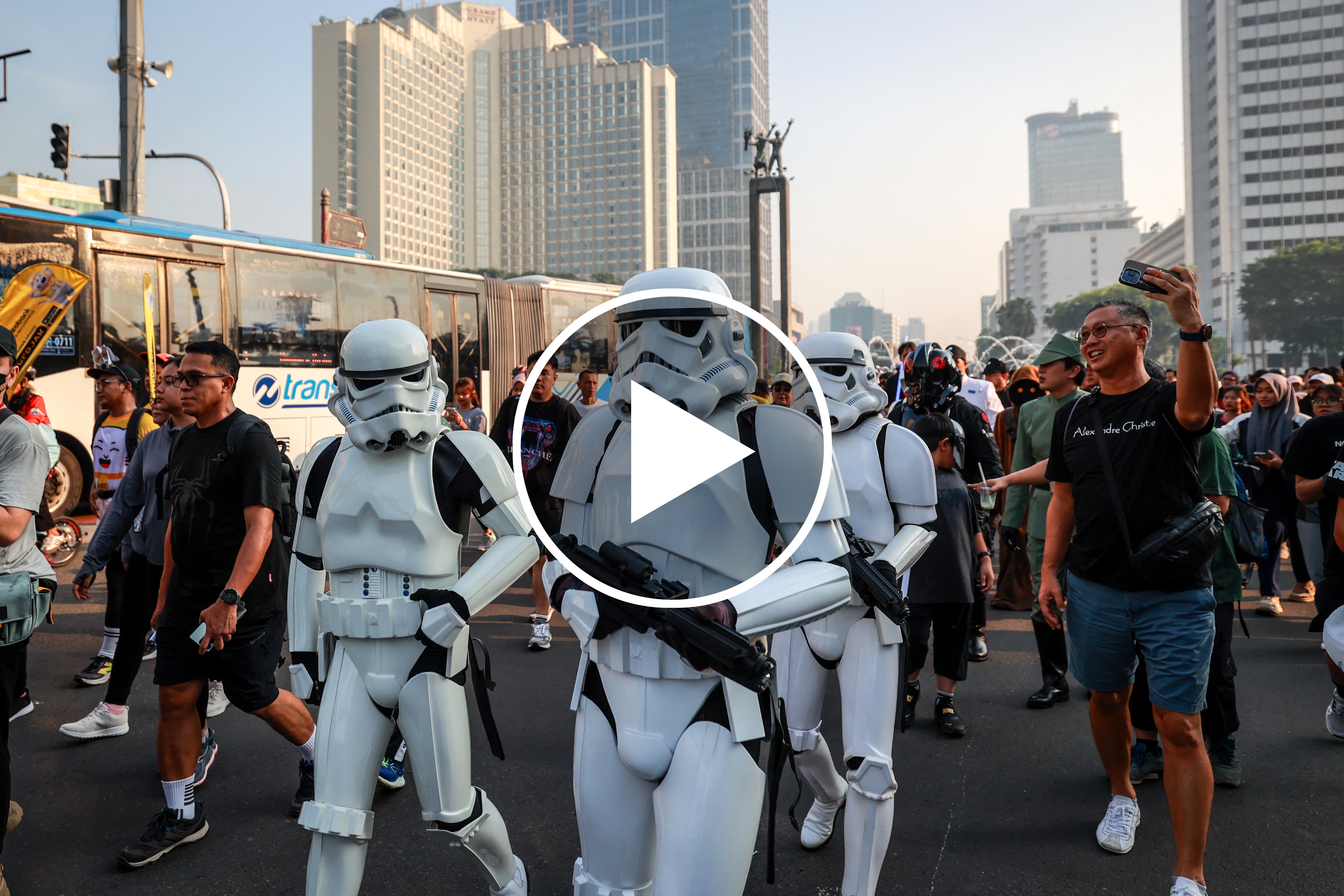 Cosplayers of Star Wars, a popular science fiction franchise, walk during a promotional event for an upcoming film on a street in Jakarta on May 3, 2026, ahead of Star Wars Day on May 4, a fan celebration inspired by a pun on the film's famous line "May the Force be with you". (Photo by Yoga Cita / AFP via Getty Images)
