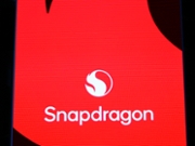 The Snapdragon corporate logo is illuminated at the Qualcomm pavilion in Hall 3 of the Fira Gran Via, representing the launch of the Snapdragon 8 Elite Gen 5 (SM8850-AC) mobile platform during the Mobile World Congress in Barcelona, Spain, on March 5, 2026. The 3nm architecture processor features the new Oryon V3 CPU and an enhanced Hexagon NPU capable of delivering over 80 TOPS for on-device generative AI. The branding highlights the expansion of the Snapdragon ecosystem into automotive with the Snapdragon Cockpit Elite and computing with the Snapdragon X Elite Gen 2, which powers the latest Windows 11 Copilot+ PCs. The exhibit showcases seamless multimodal AI processing across smartphones, XR glasses, and connected vehicles, emphasizing the Qualcomm AI Stack and ultra-low latency 5G-Advanced connectivity through the Snapdragon X85 Modem-RF System. (Photo by Joan Cros/NurPhoto via Getty Images)