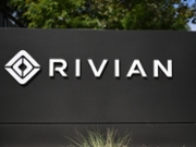 The Rivian electric vehicle logo is displayed outside the company's Venice Hub space in the Venice Beach neighborhood of Los Angeles, California on June 17, 2026. (Photo by Patrick T. Fallon / AFP via Getty Images)