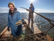 EASTPOINT, FL- JANUARY 3, 2018: Victor Causey, left, shows some of the oysters he and James Creamer tonged up from the cat point oyster reef in Apalachicola Bay. (Photo by Mark Wallheiser for The Washington Post via Getty Images)