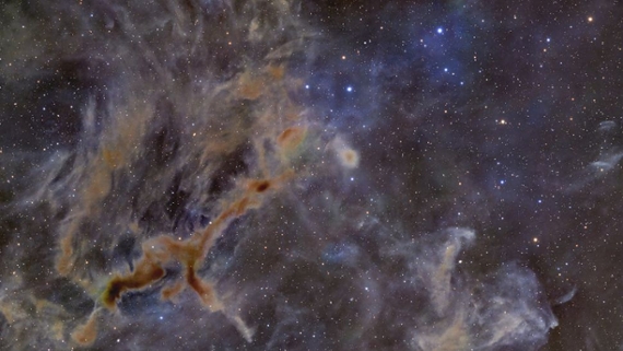Eerie dark nebula resembles a giraffe in space