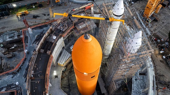 Watch crane lift space shuttle Endeavour into place