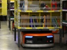 Robots with integrated AI take on multiple roles at Amazon