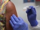 States expand COVID-19 vaccine access as cases top 30M