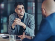 Focus on a young businessman during a meeting
