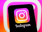 The Instagram logo is displayed on a smartphone screen with the app icon in the background, in Creteil, France, on May 15, 2026. A new ephemeral photo sharing feature is available on the Instagram app and via a standalone app. (Photo by Samuel Boivin/NurPhoto via Getty Images)