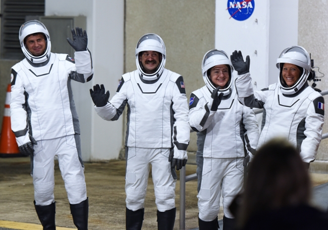 CAPE CANAVERAL, FLORIDA, UNITED STATES - FEBRUARY 13: Crew-12 mission astronauts wave after walking out of the Neil A. Armstrong Operations and Checkout Building before heading to pad 40 for launch to the International Space Station (ISS) aboard a SpaceX Falcon 9 rocket and Crew Dragon spacecraft at the Kennedy Space Center on February 13, 2026 in Cape Canaveral, Florida. (L-R) Roscosmos cosmonaut Andrey Fedyaev, NASA astronauts Jack Hathaway and Jessica Meir and European Space Agency (ESA) astronaut Sophie Adenot will live and conduct research, technology demonstrations, and maintenance experiments aboard the orbiting laboratory for eight months. (Photo by Paul Hennessy/Anadolu via Getty Images)