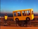 Police stop people on bridge dressed up as a bus