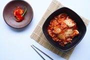 Kimchi is a traditional fermented food from South Korea, made pickled Chinese cabbage seasoned with red chili peppers, or gochugaru, garlic, ginger, etc.