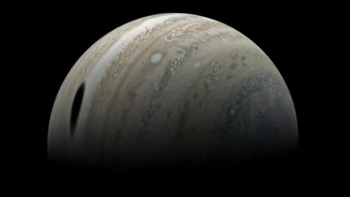 Jupiter's big moon Ganymede casts giant shadow in stunning Juno photo