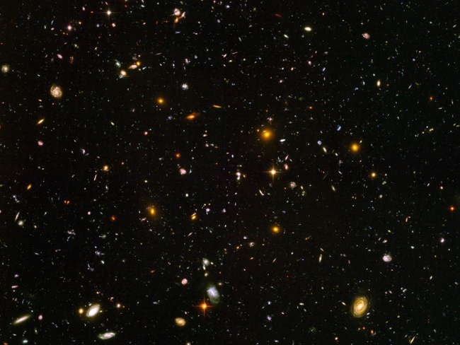 Ancient universe surprisingly crowded by monster black holes