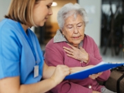 Worried senior patient talking with compassionate doctor. Scheduling date, time of examination. Emotional support from healthcare workers for elderly woman.