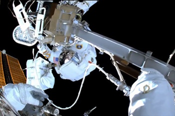 Spacewalking astronauts replace space station camera (and more) after wardrobe malfunction