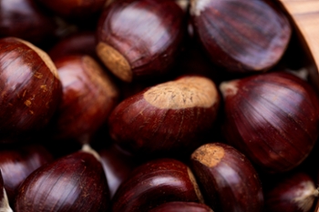 wooden bowl with natural chestnuts