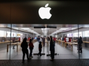 SAN DIEGO, CALIFORNIA - DECEMBER 10: An Apple logo is displayed outside their store at Fashion Valley, an upscale shopping mall on December 10, 2025 in San Diego, CA. (Photo by Kevin Carter/Getty Images)