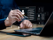 HR management with AI recruiting technology concept: Businessman uses a laptop recruitment process to check the scores and qualifications of applicants through an online system, Best human resource