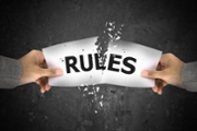 Businessman stress, ripping up rule word on paper