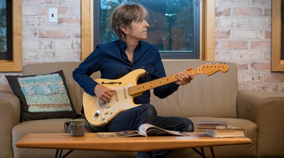 Hear Eric Johnson's new singles, Love Will Never Say Goodbye and Sitting on Top of the World