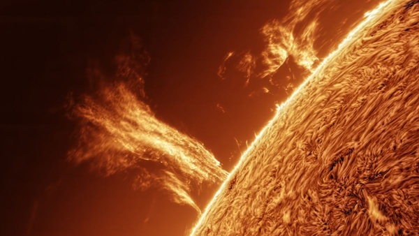 Watch a 100,000-mile-high plasma tower erupt from the sun