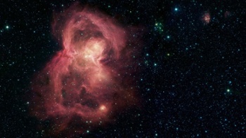 Butterfly Nebula glows red in spectacular view from Spitzer Space Telescope