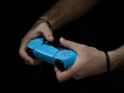 An Iranian gamer uses a PS5 controller to participate in a video game competition during the 11th Iran Video Games Festival at the Tehran Milad Tower Cultural and Recreational Complex in Tehran, Iran, on February 18, 2026. (Photo by Morteza Nikoubazl/NurPhoto via Getty Images)