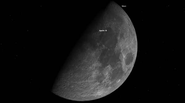 A half lit moon is shown in a black sky.